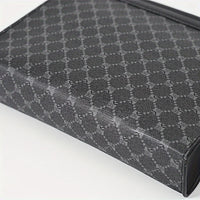 Close-up of a textured black and gray patterned box on a white background