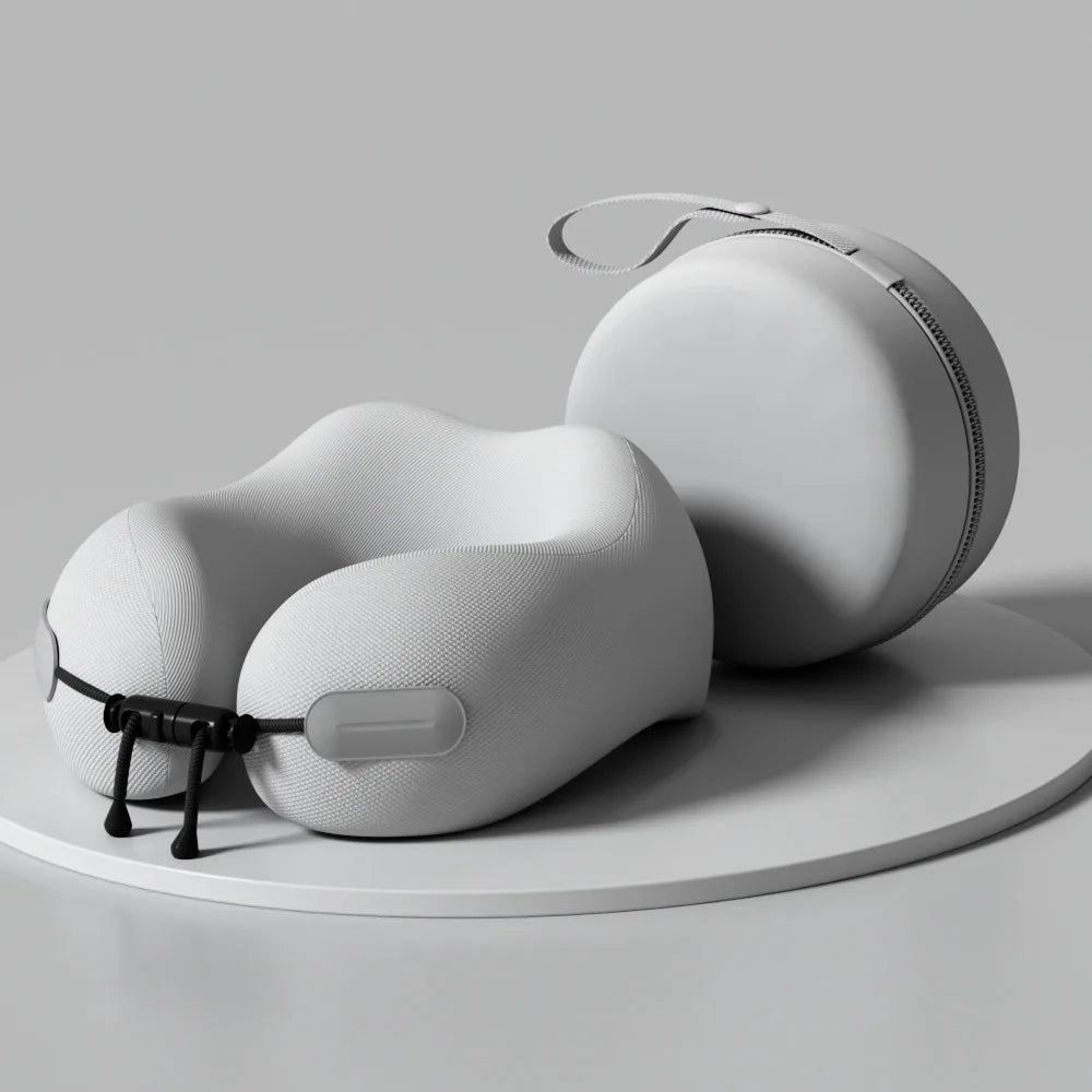 White travel neck pillow with carrying case on a gray background