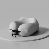 Gray travel neck pillow on a light gray background