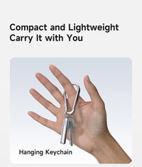 Hand holding a hanging keychain with text 'Compact and Lightweight, Carry It with You' on a light background