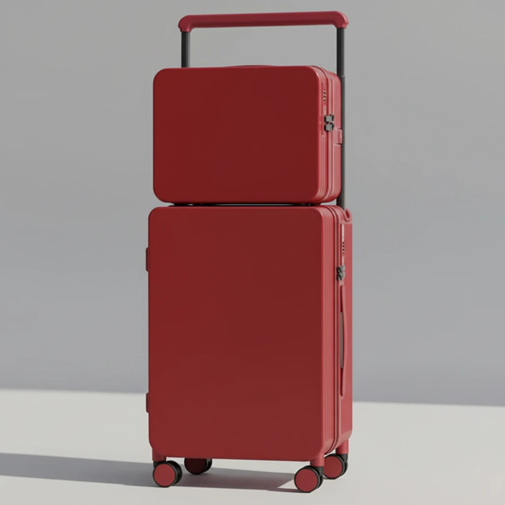 Two red suitcases stacked on a wooden floor with a neutral background