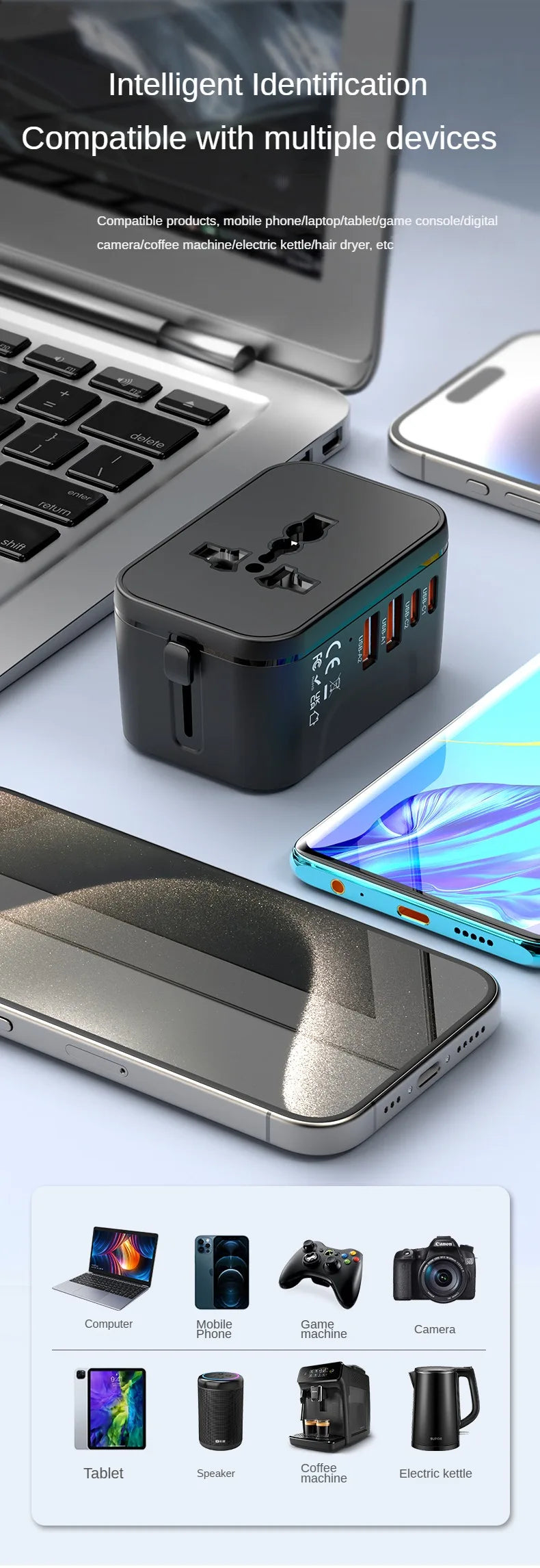 Black travel adapter with multiple ports on a light gray surface with smartphone and laptop.