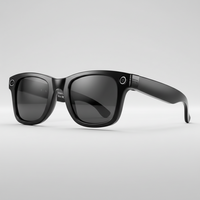 Black sunglasses with a gray gradient lens on a light gray background