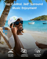 Man on a beach using wireless earbuds with scenic background