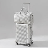 The Monarch 24-inch medium aluminum suitcase set in Arctic Silver, curated by AERIA Prestige with zipperless TSA locks and aerospace-grade alloy shell.