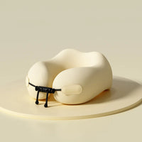 Beige travel neck pillow on a beige background