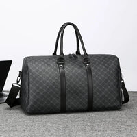 Gray patterned duffel bag with black straps on a light gray surface.