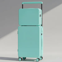 Turquoise suitcase set on a wooden floor with a neutral background