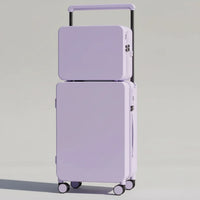 Set of two purple suitcases on a wooden floor with a neutral background