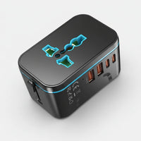 Black travel adapter with multiple ports on a white background