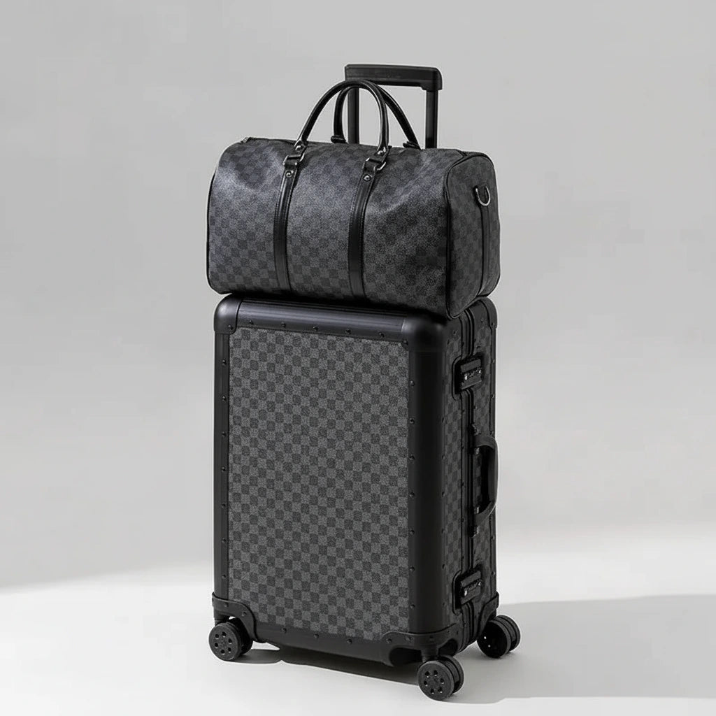 The Monarch premium aluminum luggage set in Midnight Onyx, featuring a zipperless interlocking frame, curated and certified by AERIA Prestige.