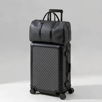 The Monarch premium aluminum luggage set in Midnight Onyx, featuring a zipperless interlocking frame, curated and certified by AERIA Prestige.