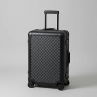 The Monarch premium aluminum suitcase in Midnight Onyx, featuring a reinforced zipperless frame, curated and certified by AERIA Prestige.